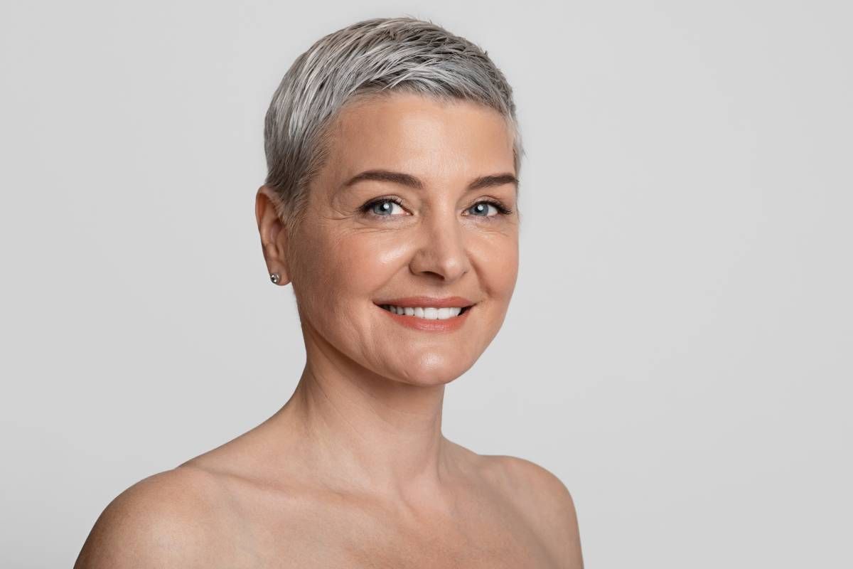 A mature woman with gorgeous skin after facial rejuvenation near Lexington, Kentucky (KY)