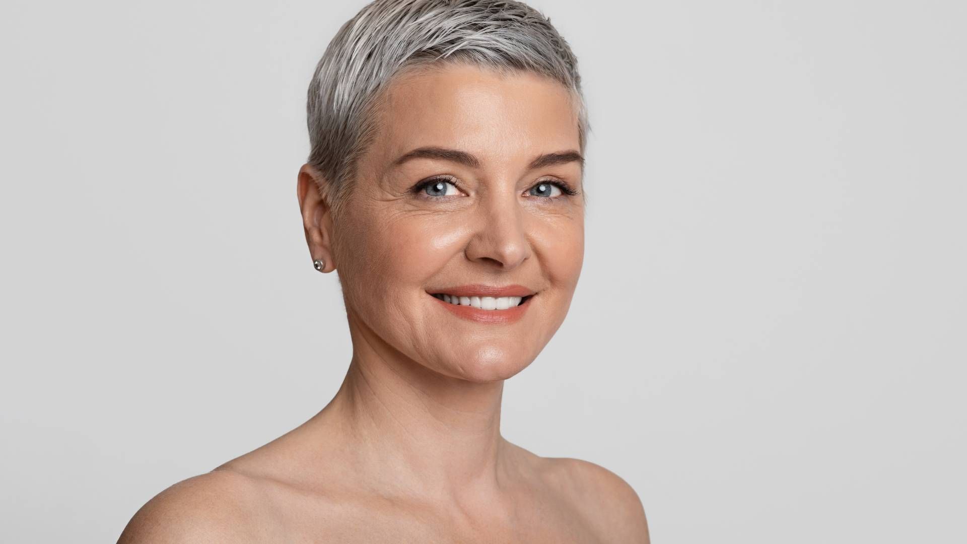 A mature woman with gorgeous skin after facial rejuvenation near Lexington, Kentucky (KY)