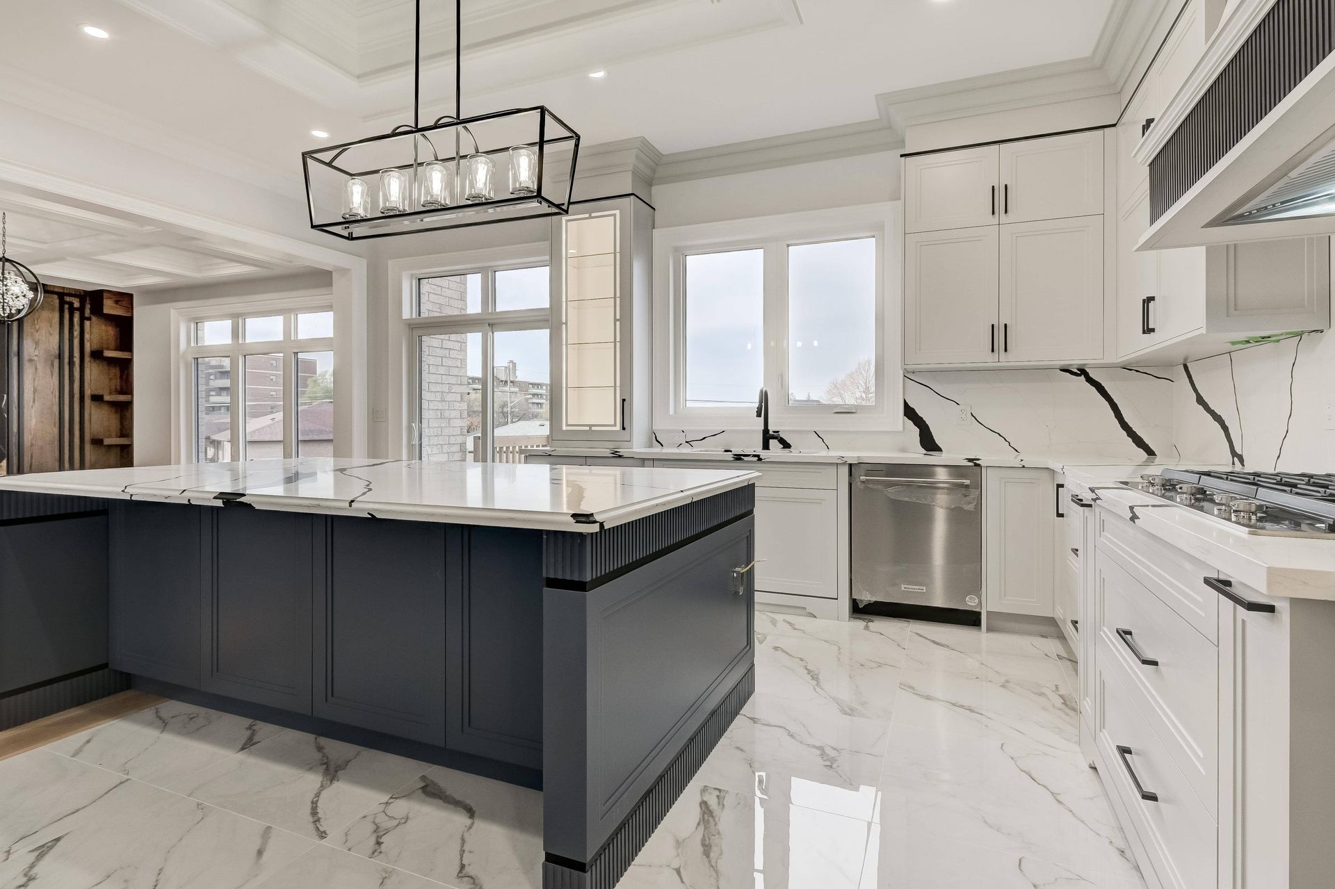 Modern kitchen with white and dark gray cabinets.