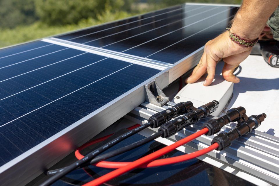 installation of solar panels on the roof of a camper van