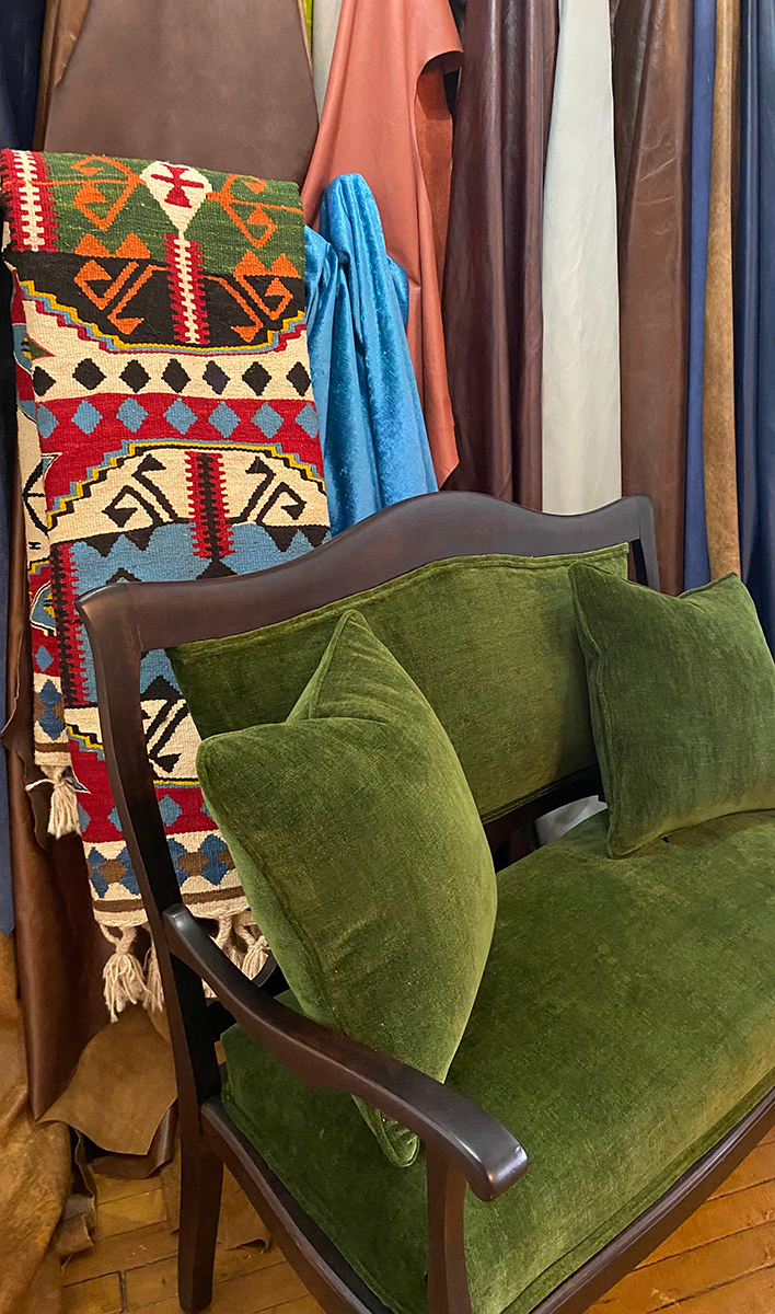 Green velvet loveseat/ Turkish rug