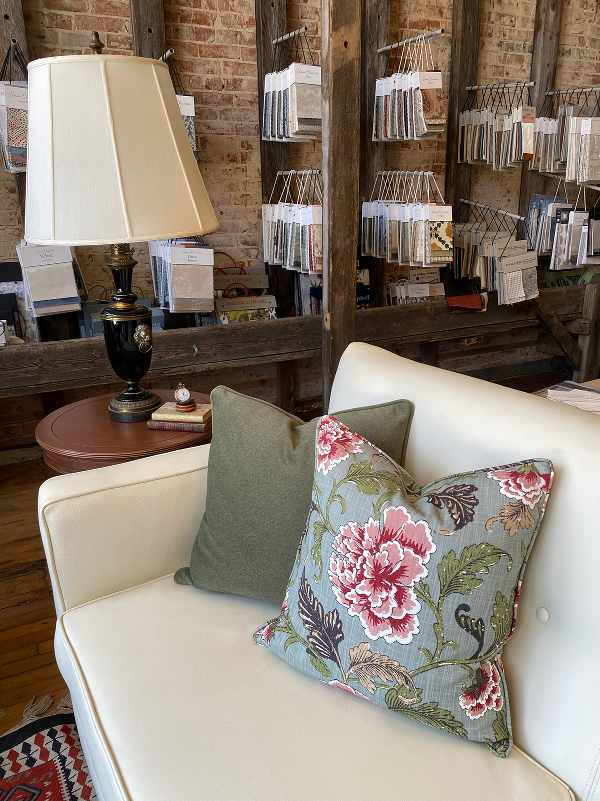 White sofa with lamp & hanging fabrics