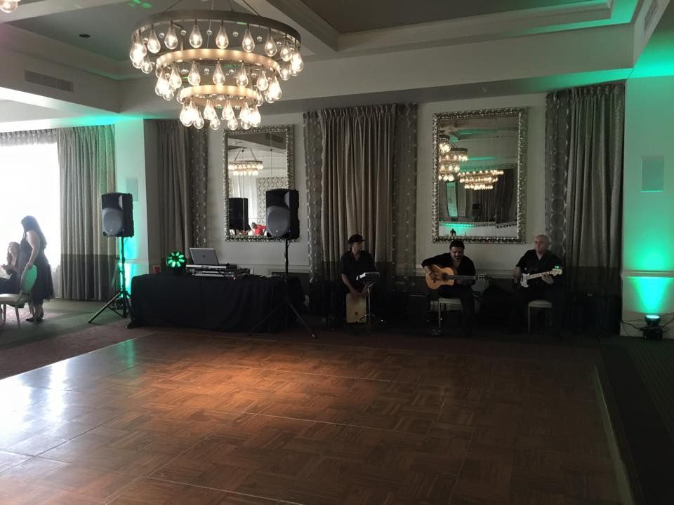 A Group of People are Playing Instruments in a Large Room — Pinellas Park, FL — Hyde's Professional DJ & Event Services