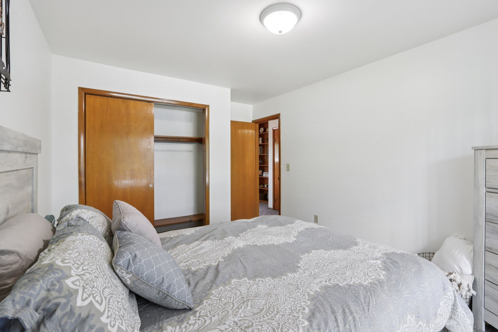 Apartment bedroom with spacious closet space at Meadow Park apartments in Bloomington, Indiana