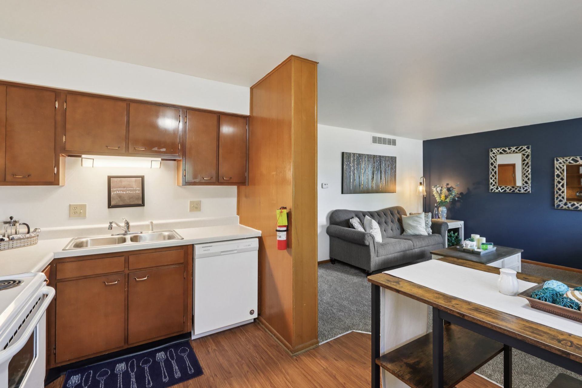 Open apartment kitchen and living room layout at Meadow Park apartments in Bloomington, Indiana