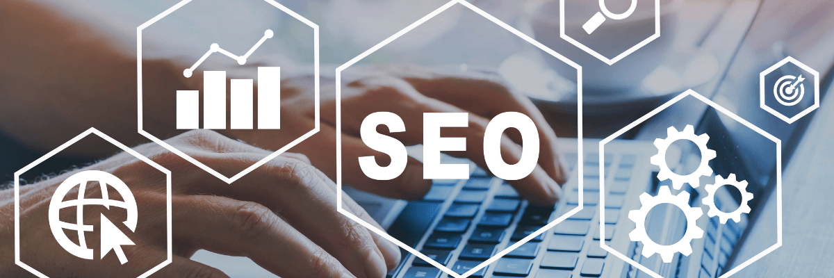 A person is typing on a laptop computer with the word seo surrounded by icons.