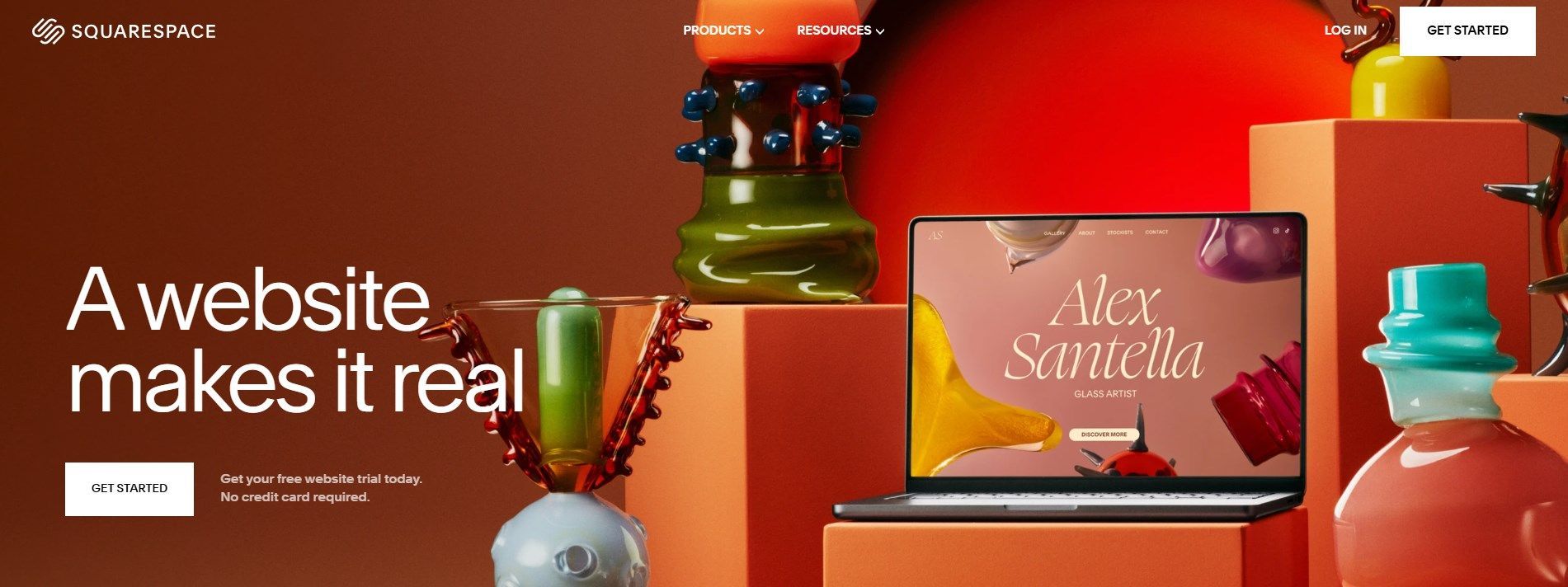 A website makes it real with a laptop on a table surrounded by vases.