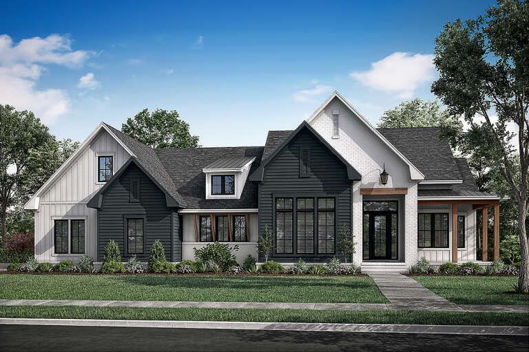 Modern single-story house with dark gray and white exterior, front lawn, and large windows