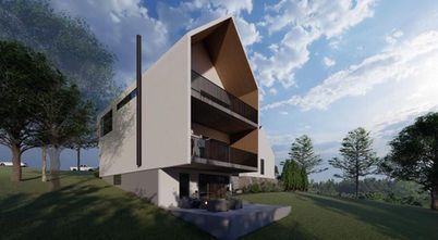 Modern multi-story house with slanted roof, open balconies, and surrounding trees in a grassy landscape.