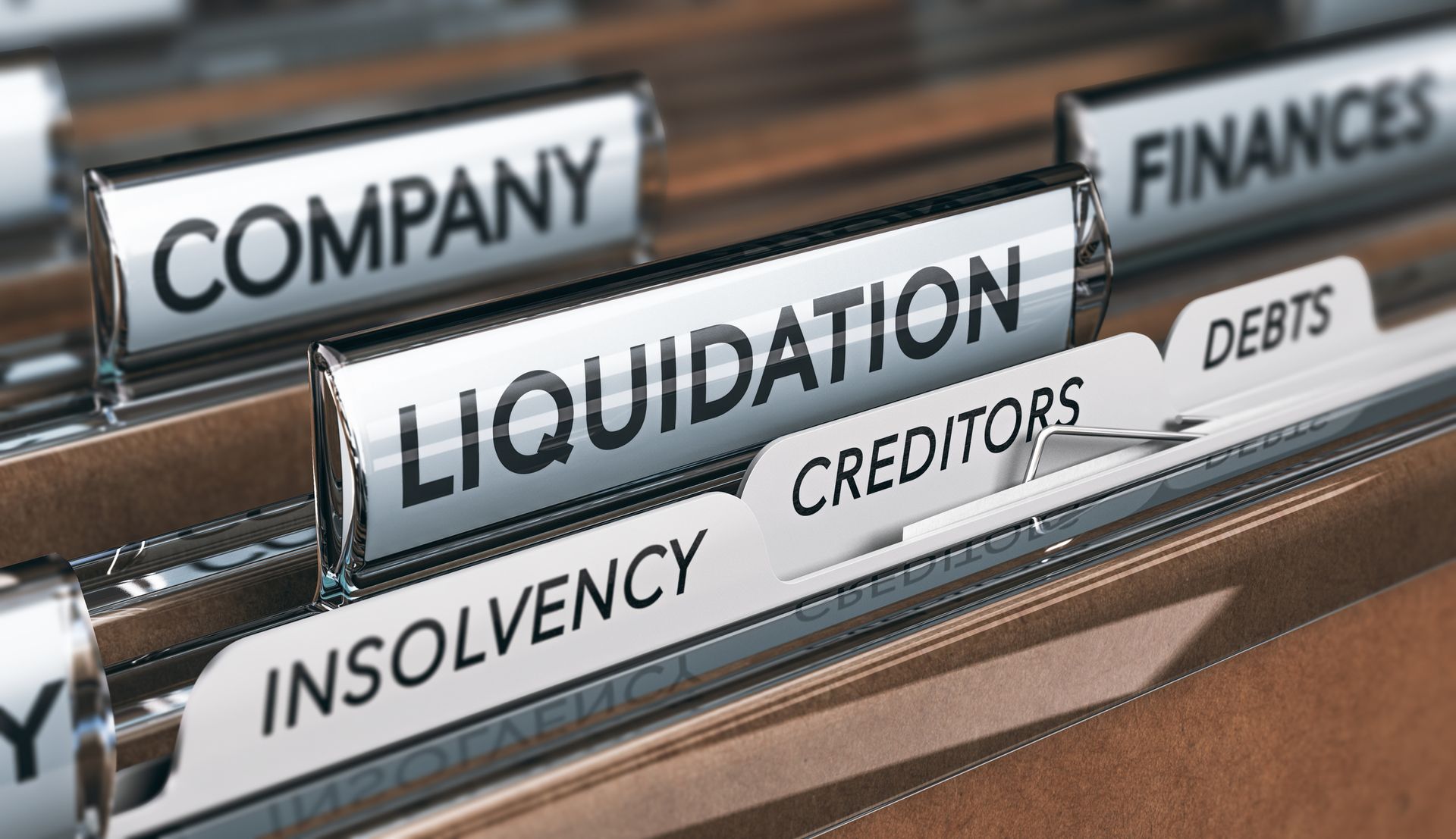 Files and tabs with the words insolvency, creditors, and debts.