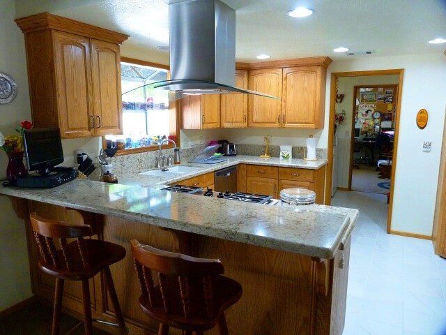 Clean kitchen with marble counter top — Hesperia, CA — Bergstrom Construction