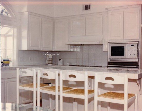 All white kitchen with chairs — Hesperia, CA — Bergstrom Construction