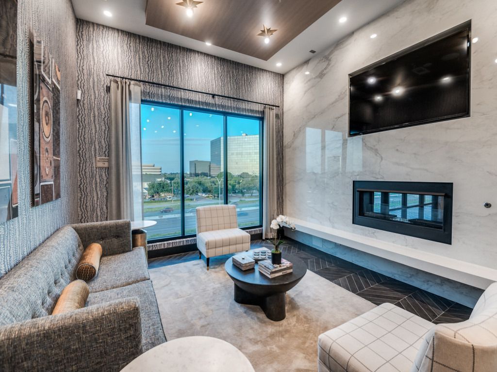 A living room filled with furniture and a fireplace.
