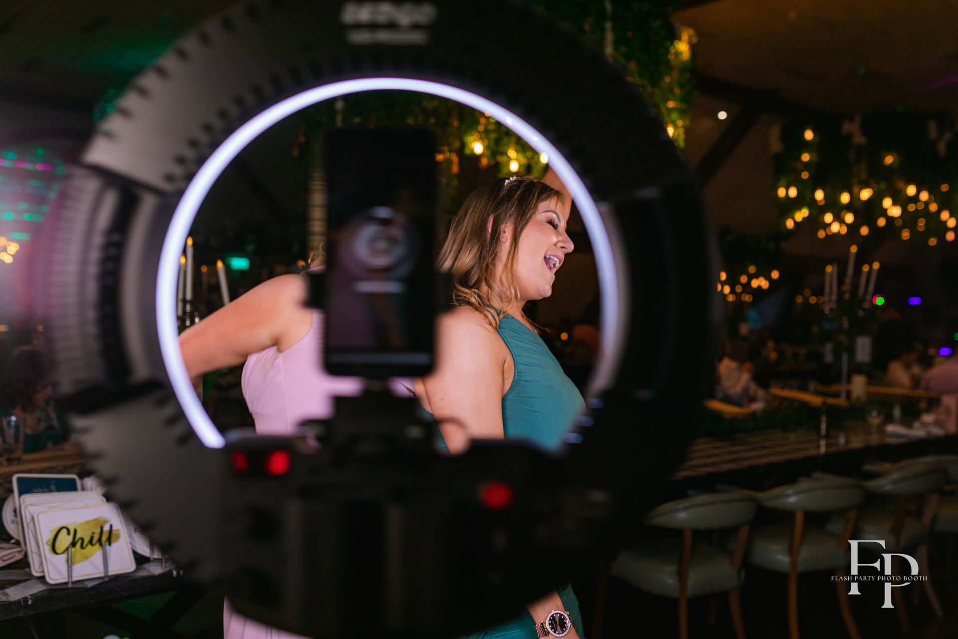 Party attendees recording fun clips with 360 photo booth