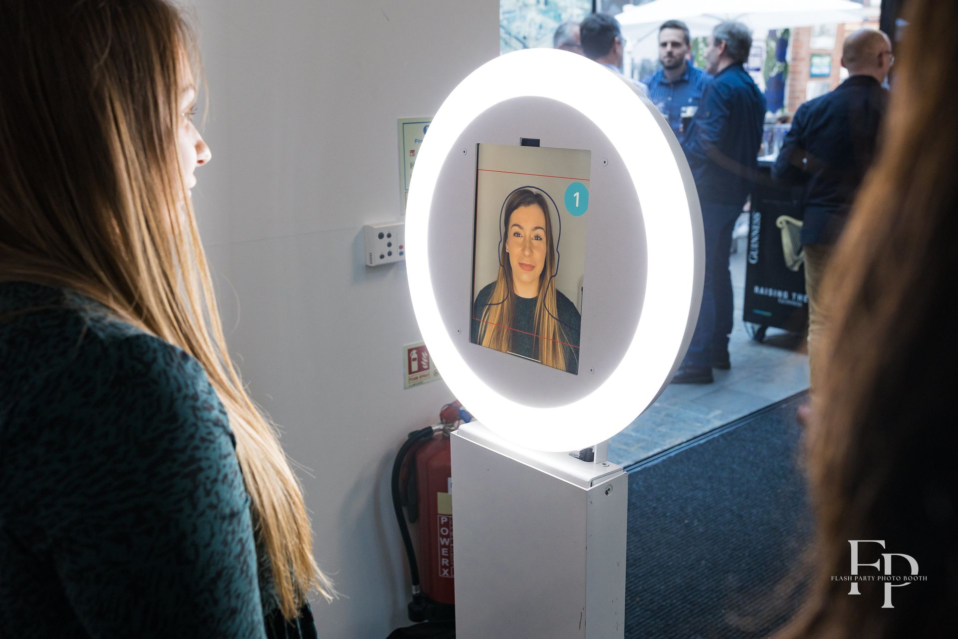 AI Sketchbot booth creating artistic portraits at Dallas corporate event