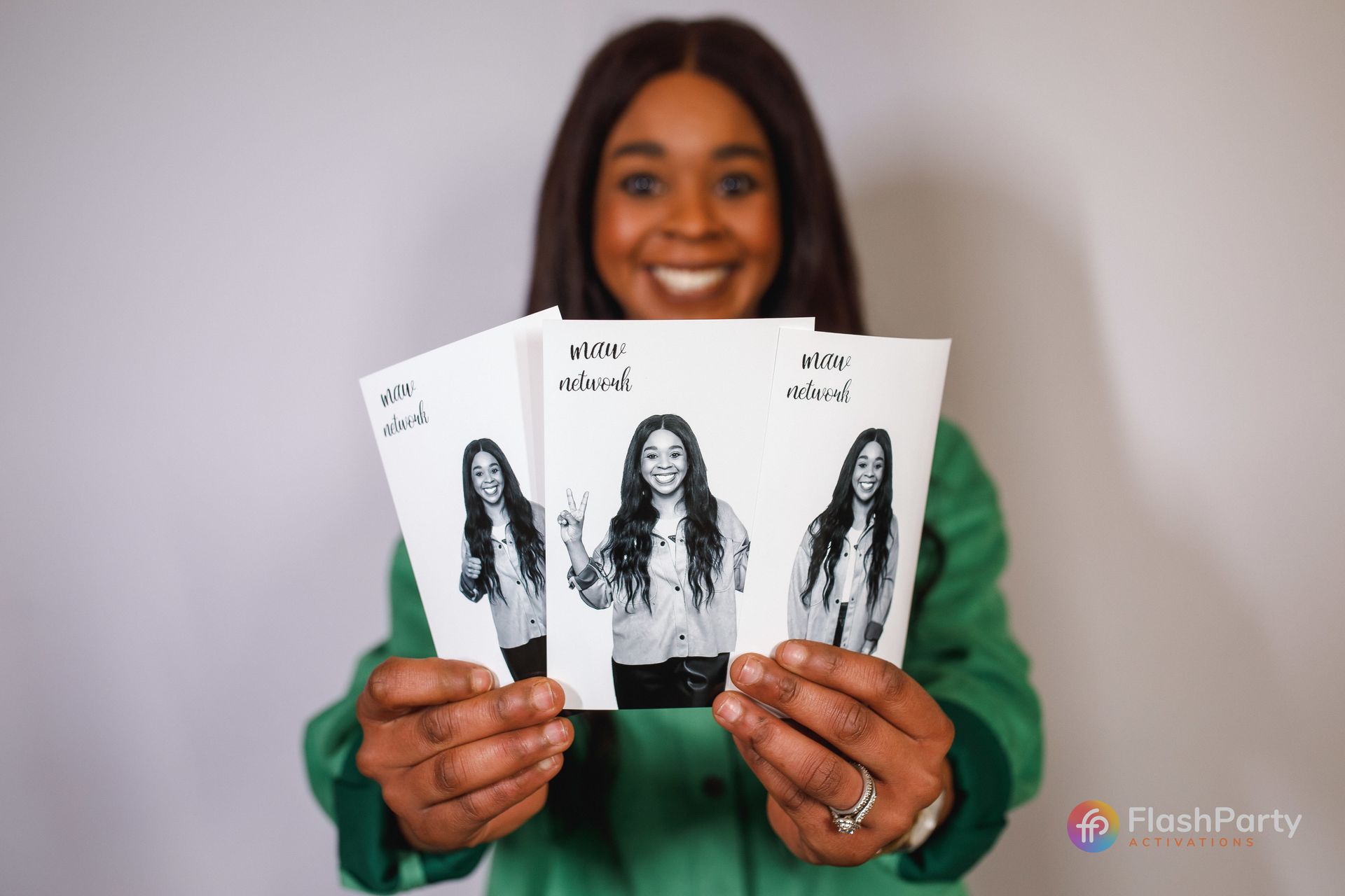 Guests receiving instant prints from glam photo booth experience