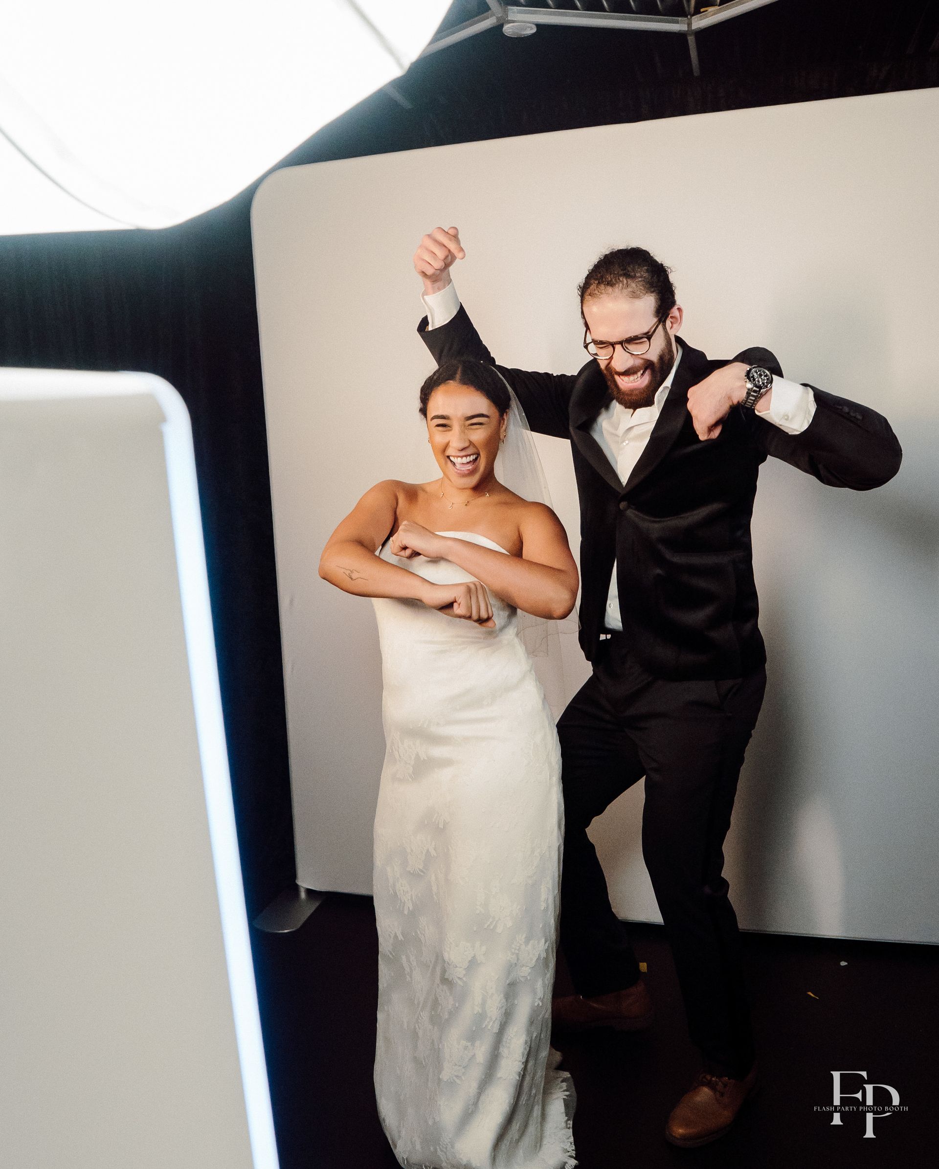 Wedding guests posing for stylish glam photo booth portraits