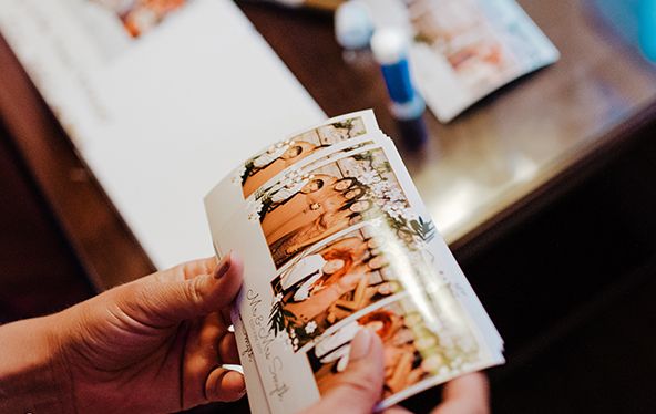Guests receiving instant prints from magic mirror photo booth