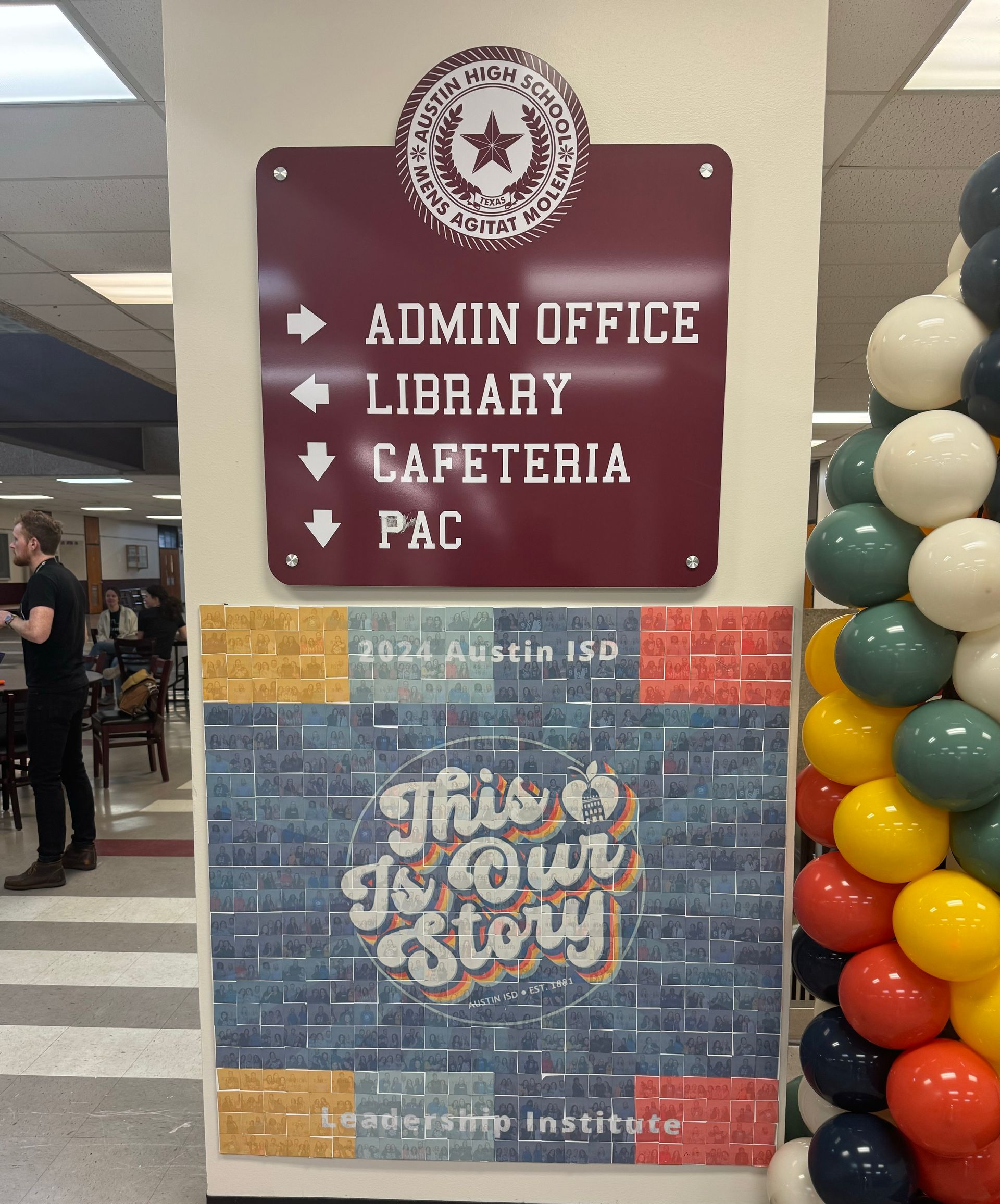 Photo mosaic wall creating a large image from hundreds of guest photos