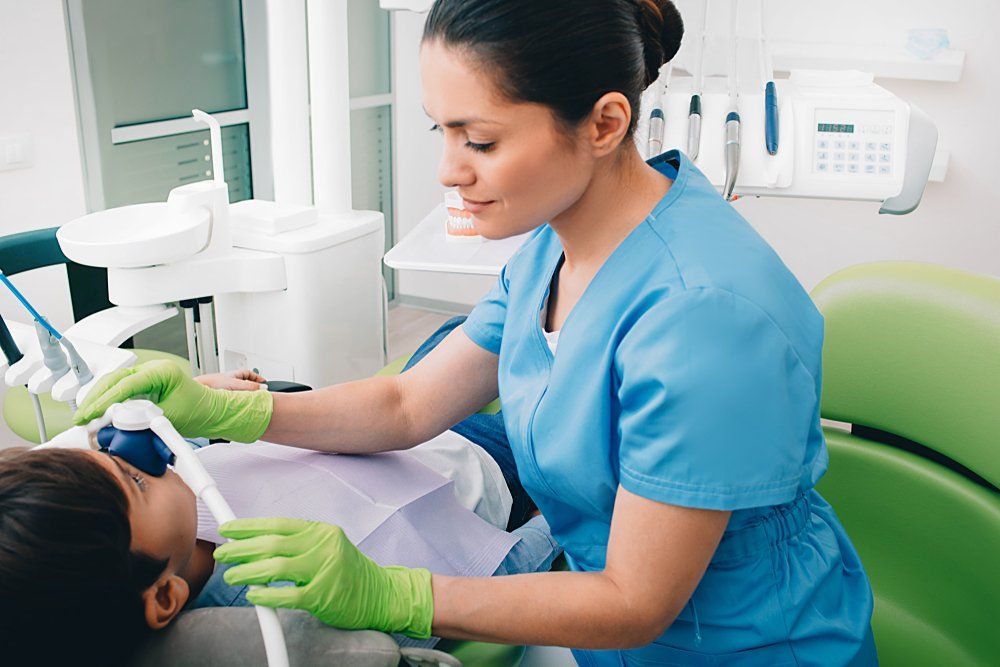 Patient Applying Nervous Patient Sedation To Patients — Dentists in Nelson Bay, NSW