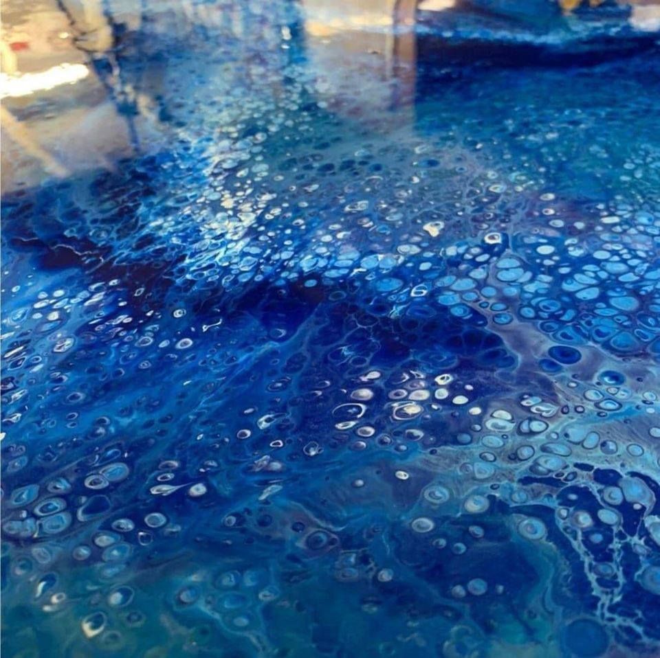 Blue abstract fluid art with white cell-like circles and marbled paint swirls