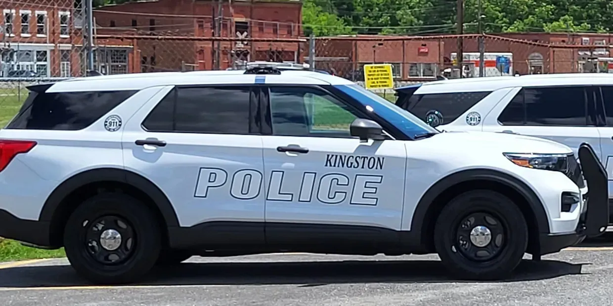 White police SUV parked on a street, marked with