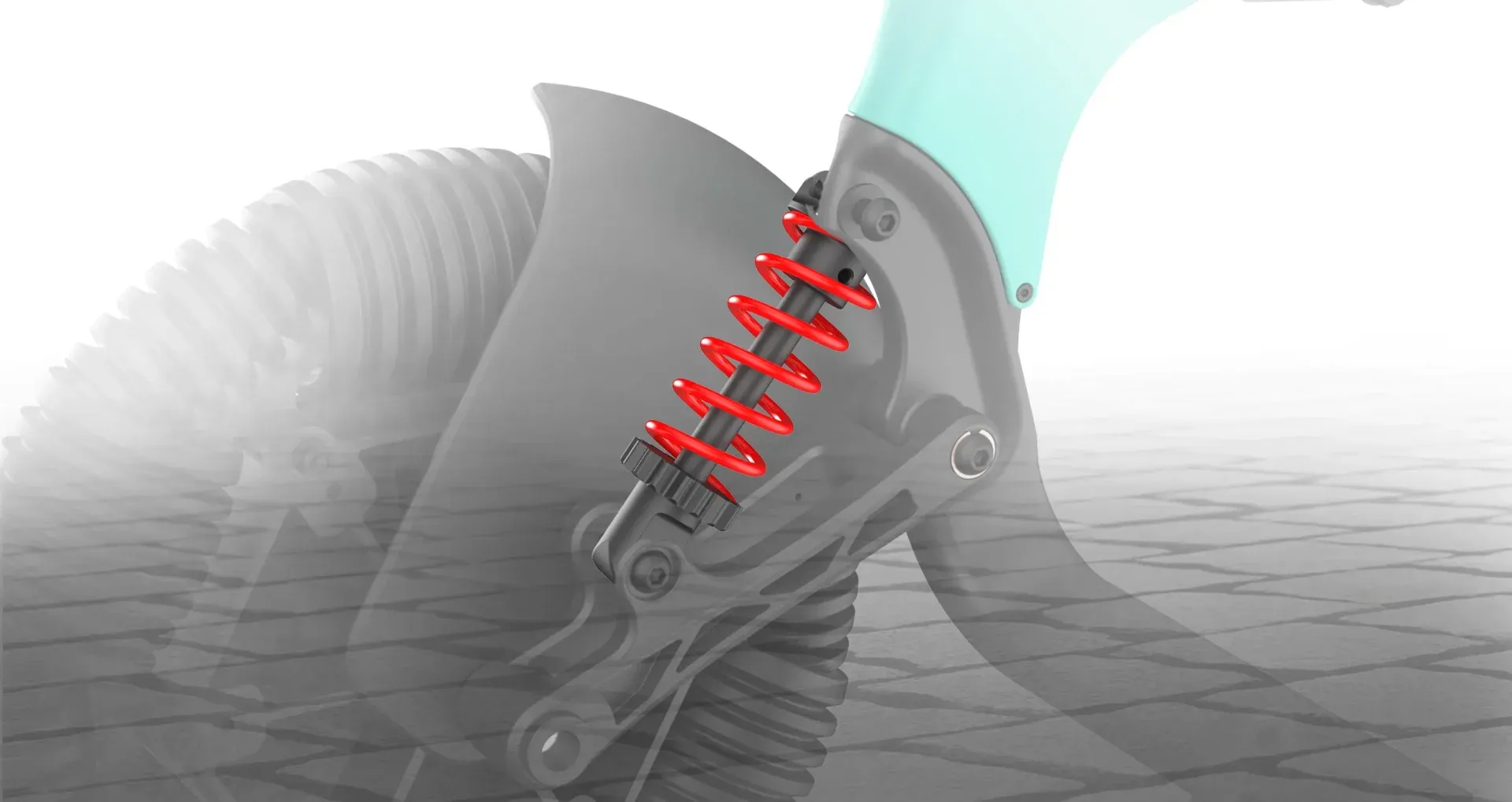 Close-up view of a red spring shock absorber on a mechanism, likely part of a vehicle's suspension system.