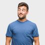 Man in a blue T-shirt looking to the side against a light gray background