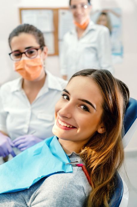 Smiling Woman with Her Dentists — Asheboro, NC — Dr. Edward Wenda, DDS, P.A. & Dr. Henry L. Vruwink