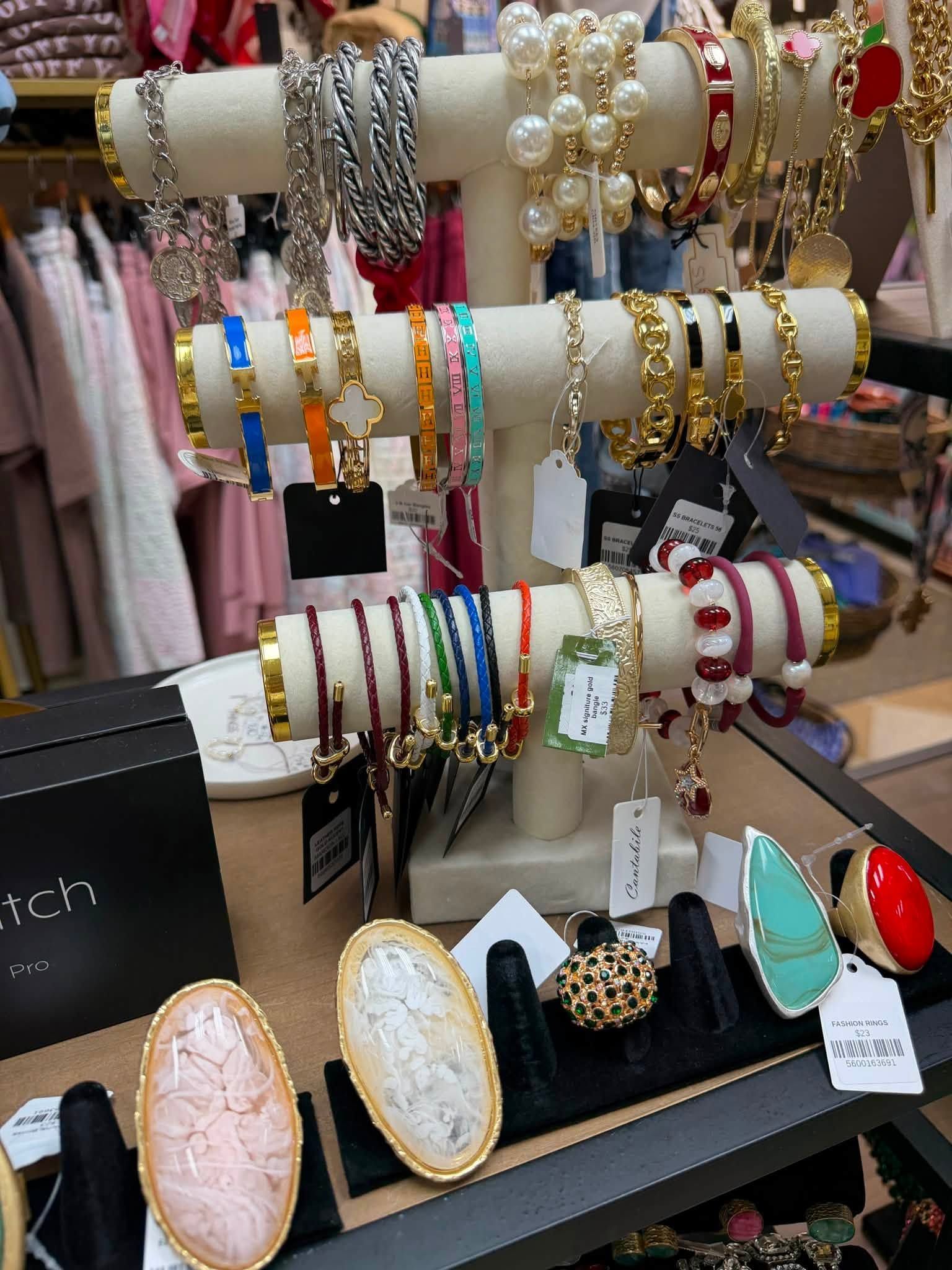 Display of colorful bracelets and watches on a jewelry stand in a shop
