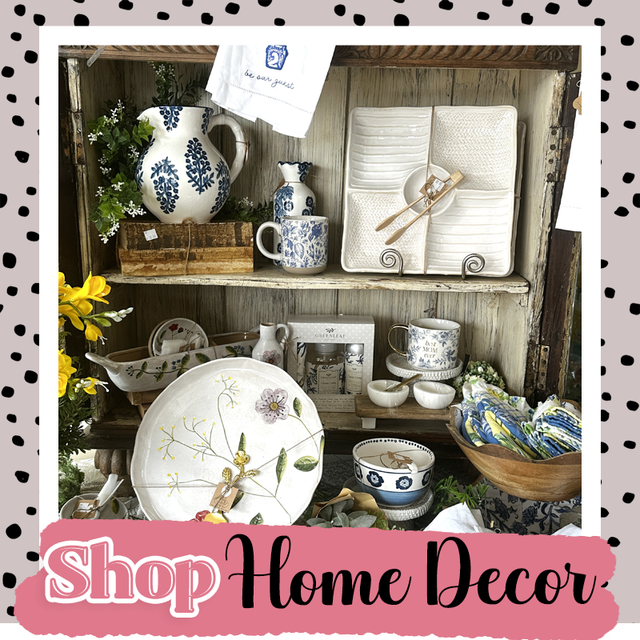 Rustic shelf of blue-and-white home decor, dishes, and vases with “Shop Home Decor” text underneath