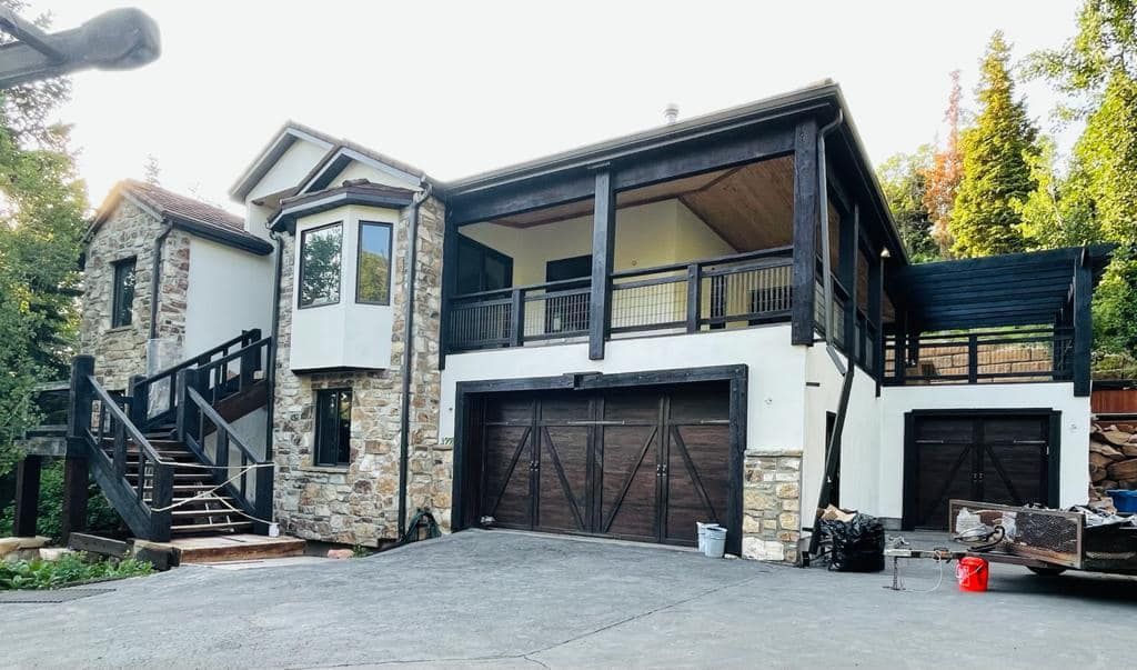 A large house with a car parked in front of it