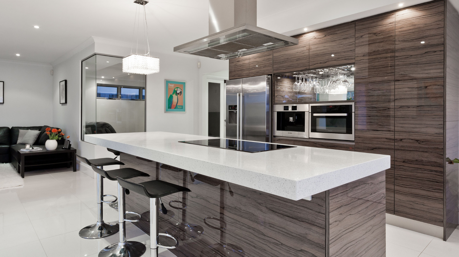 A kitchen with a large island and stools