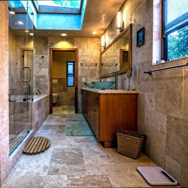 A bathroom with two sinks and a mirror