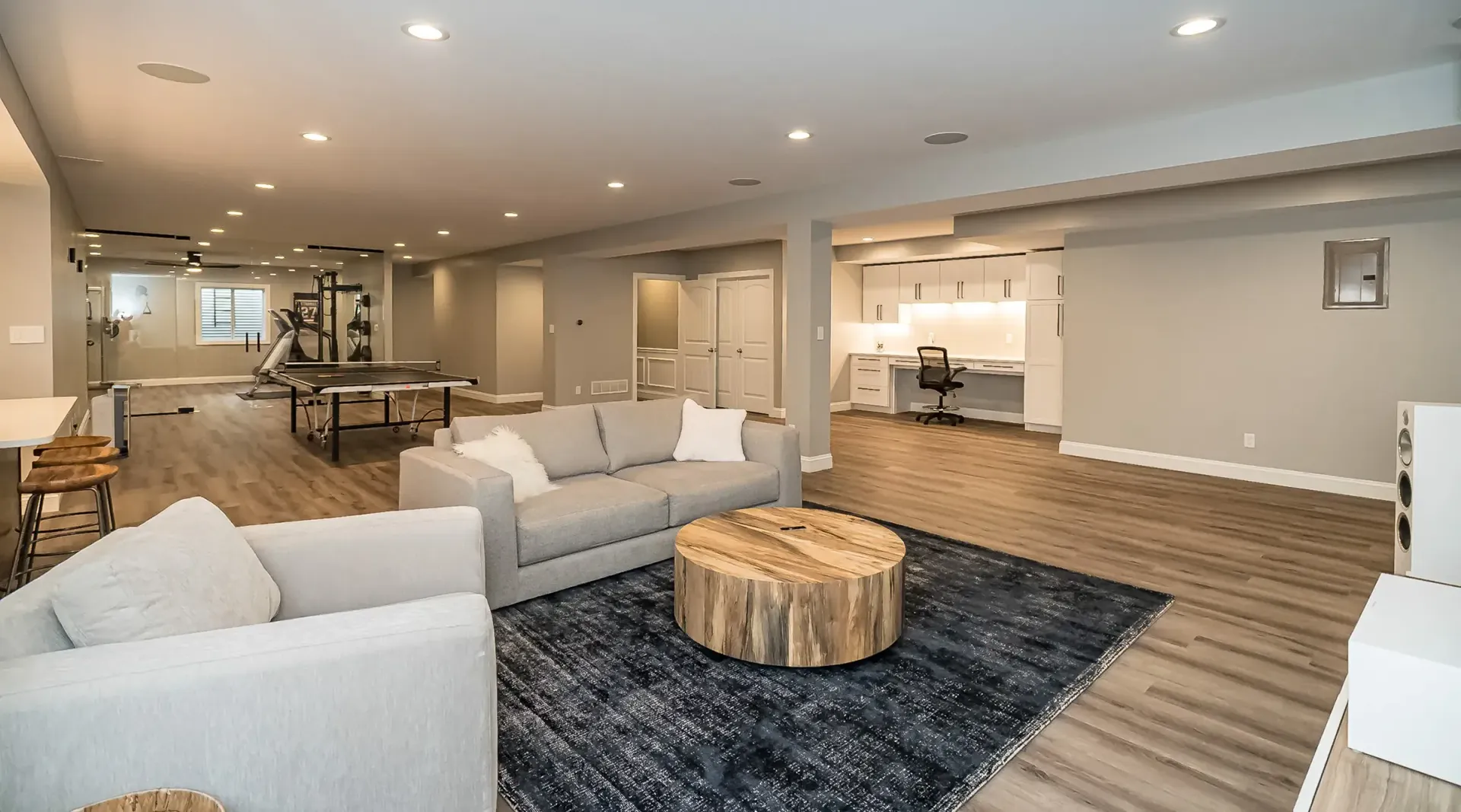 A kitchen with a large island and stainless steel appliances.