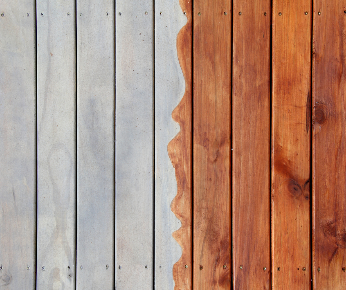 A close up of a wooden deck before and after being painted.