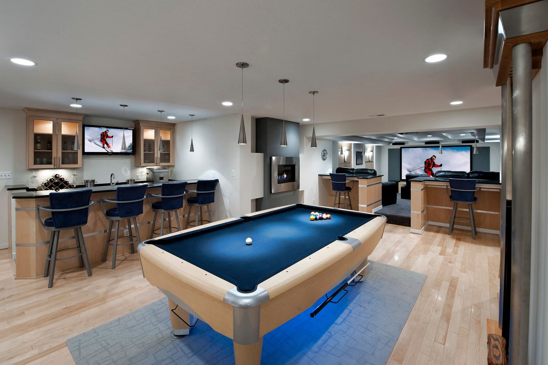A kitchen with blue cabinets and white counter tops
