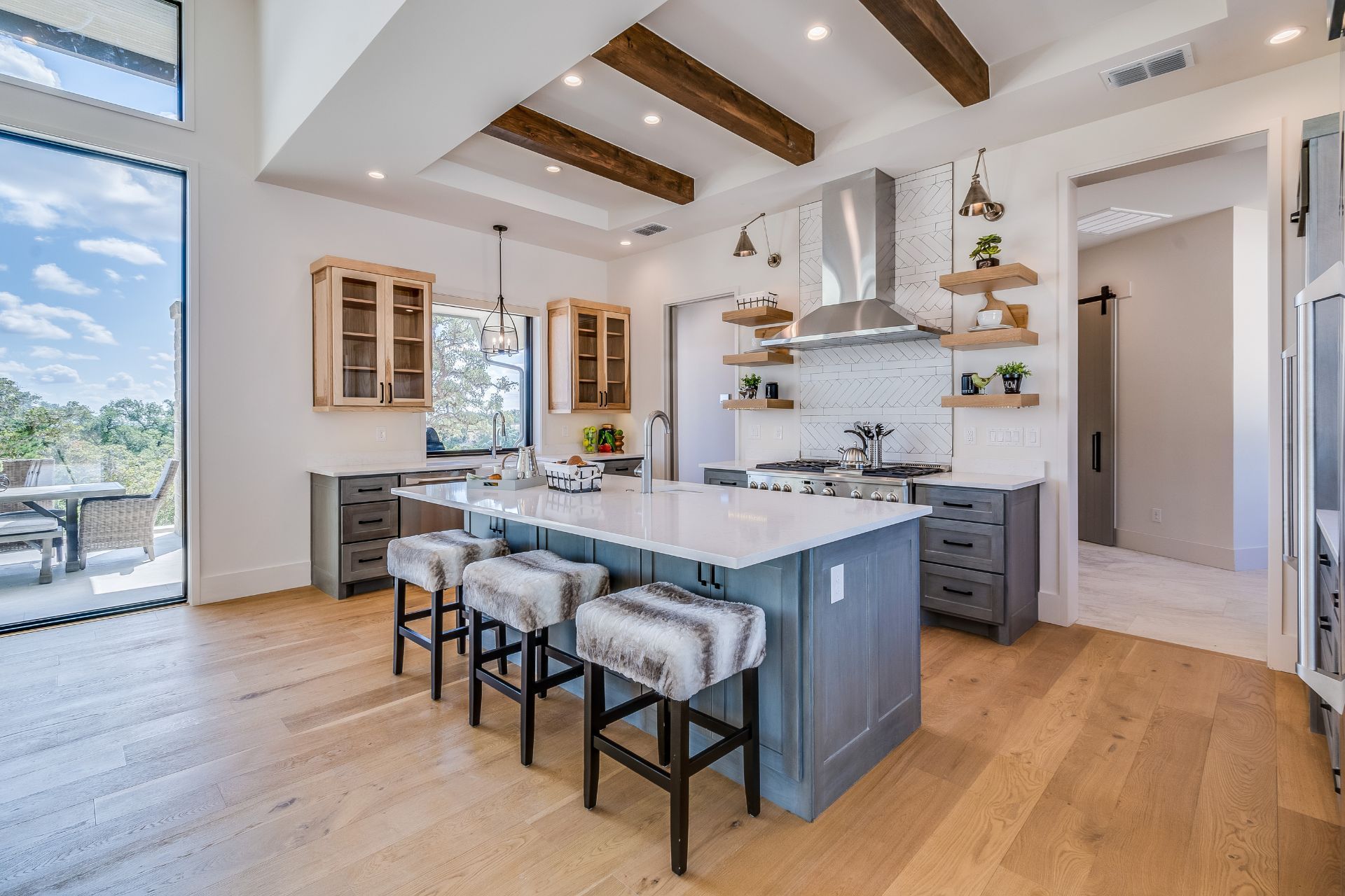 There is a large island in the middle of the kitchen.