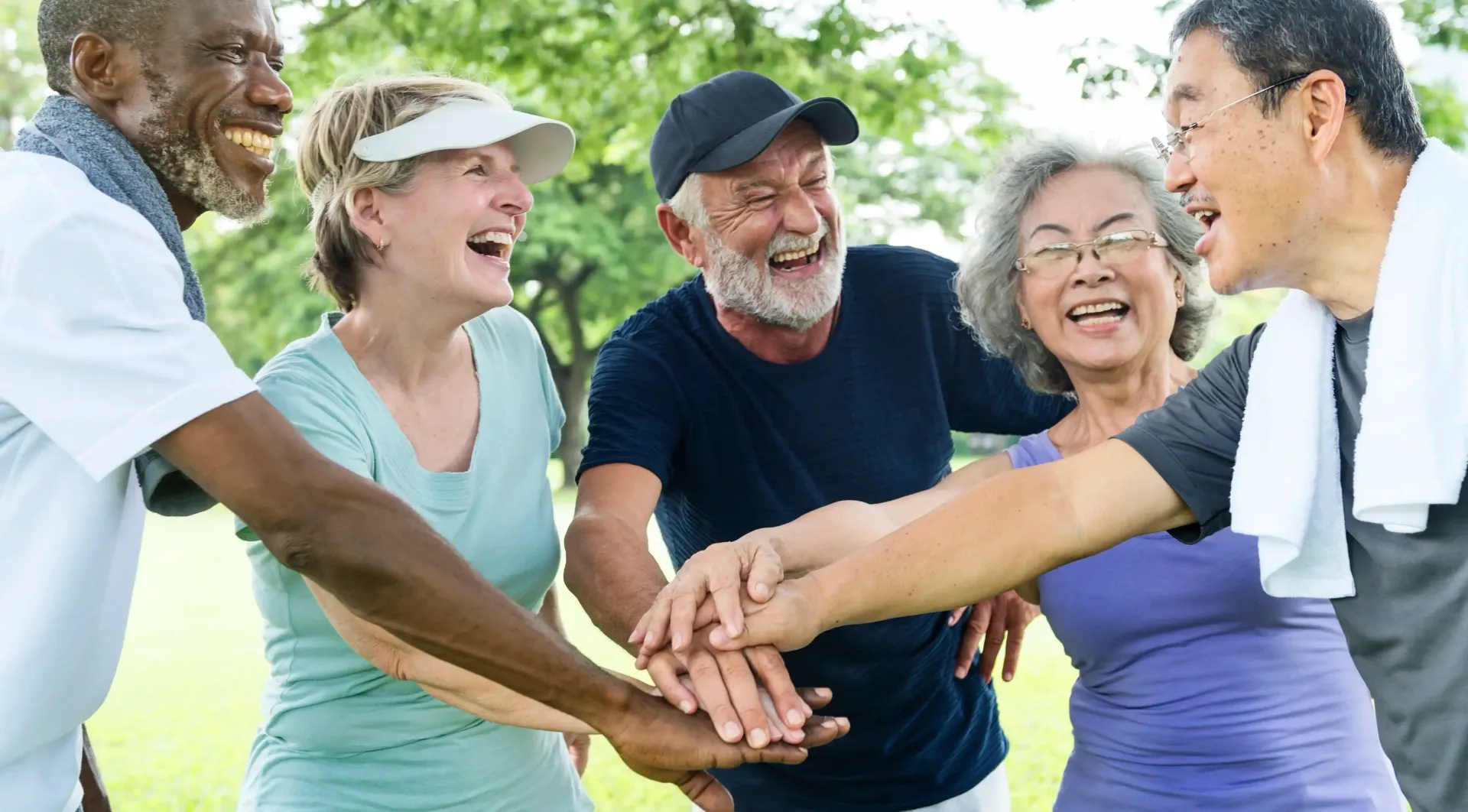 Medicare age group of people doing a team handstack