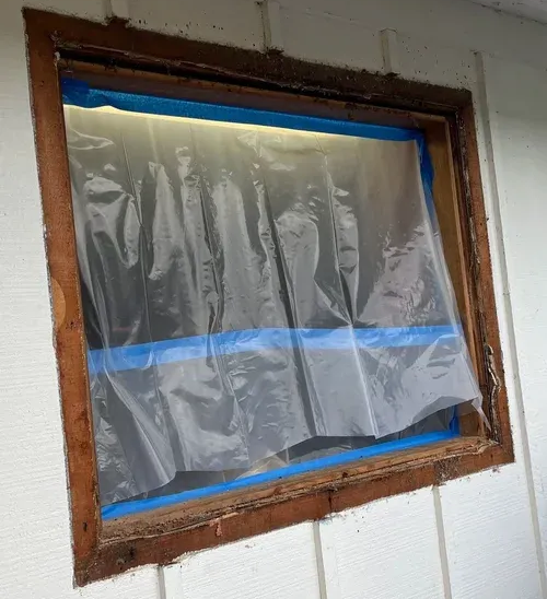 Window removal in single-wall home construction for a new replacement window to be installed.