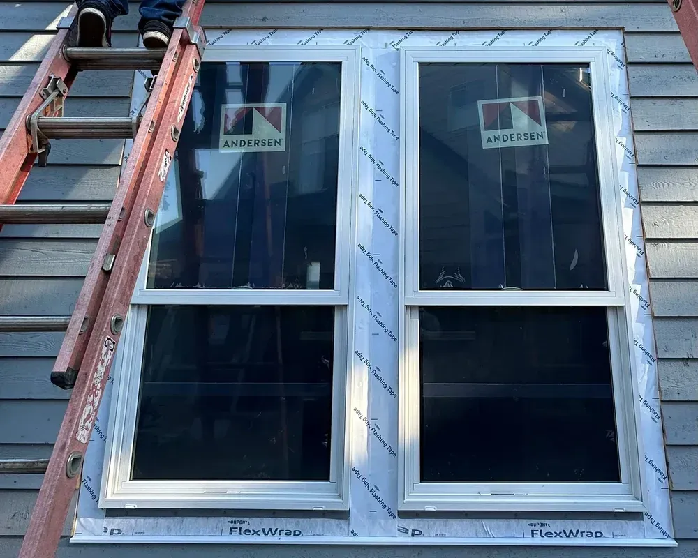 Prep opening and install replacement windows in a dual-wall home construction