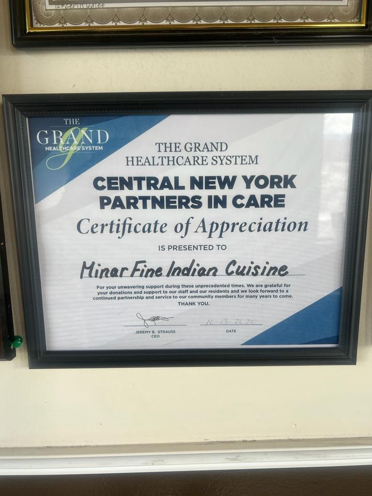 Framed certificate from The Grand Healthcare System, Central New York Partners In Care, awarded to Minar Fine Indian Cuisine.