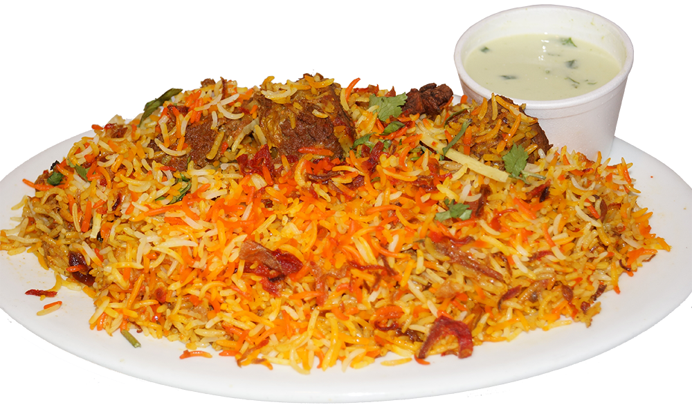 Plate of colorful biryani rice with meat and a side of yogurt sauce.