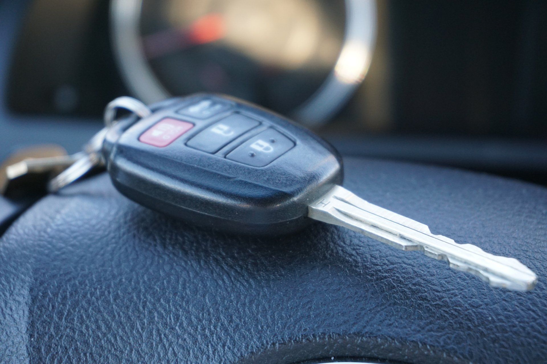Locksmith opening car door with lockpicker — Little Rock, AR — AAA Lock & Key Service Inc.