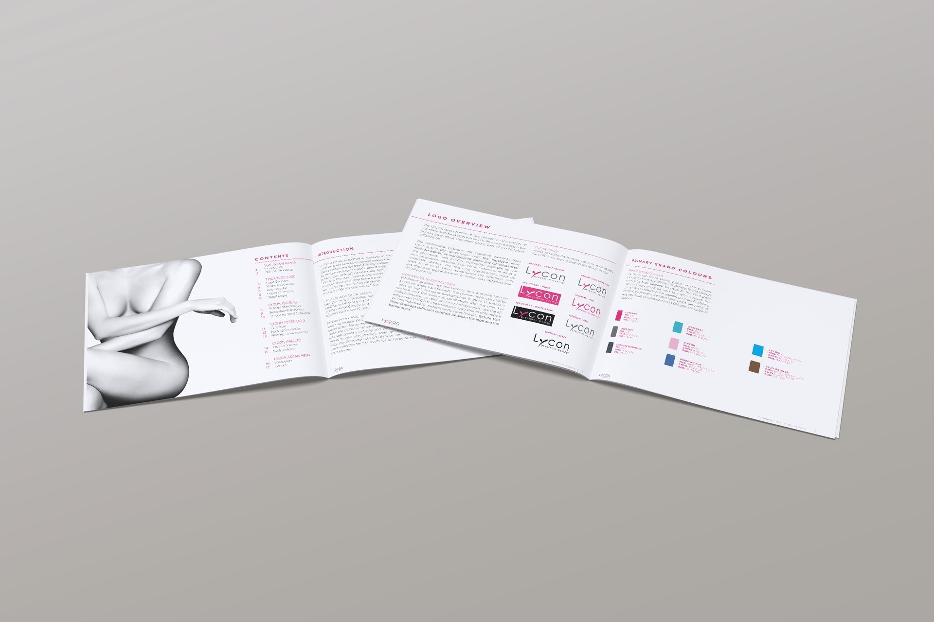 A stack of brochures sitting on top of each other on a table.