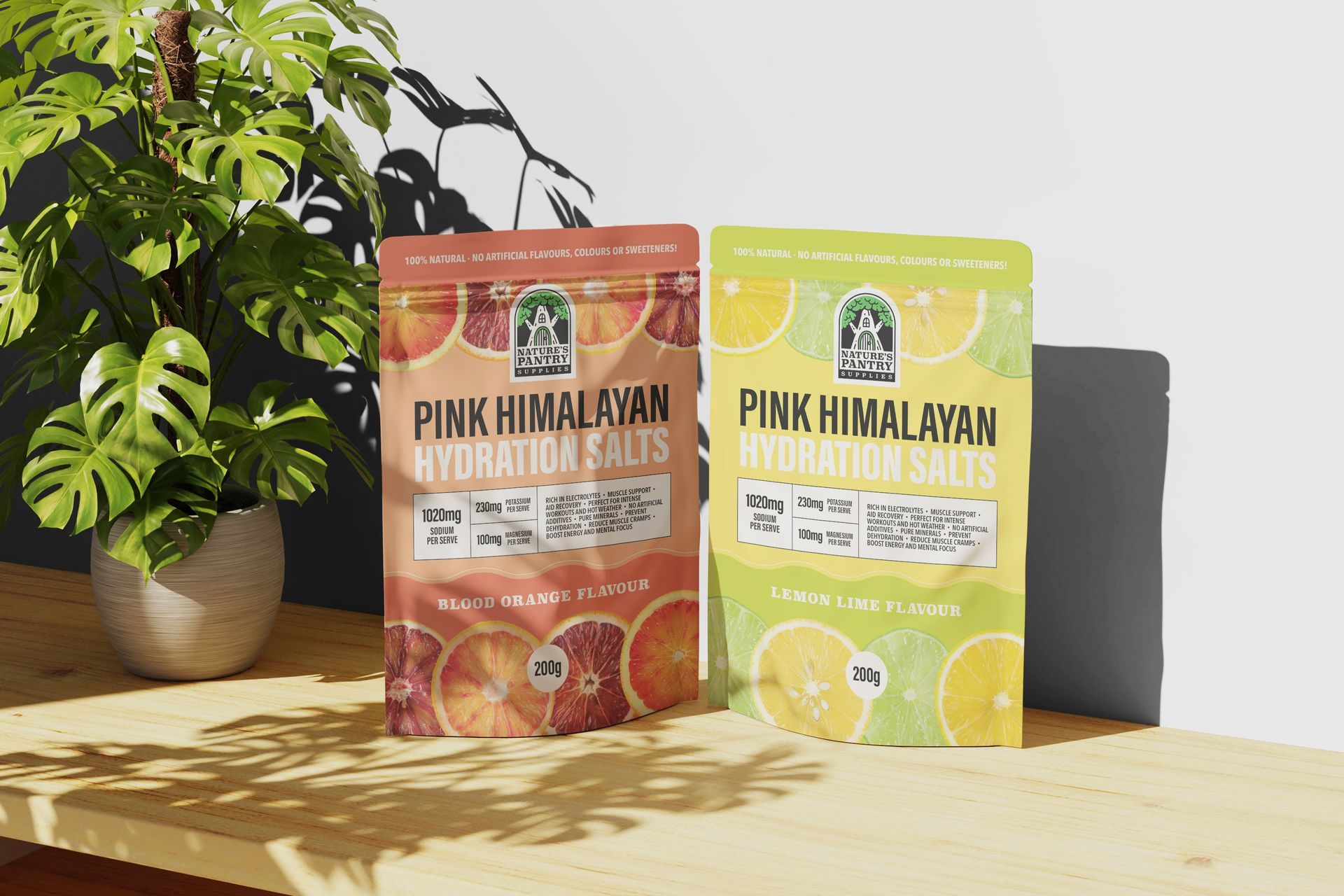 Two bags of pink himalayan hydration salts are sitting on a wooden table.
