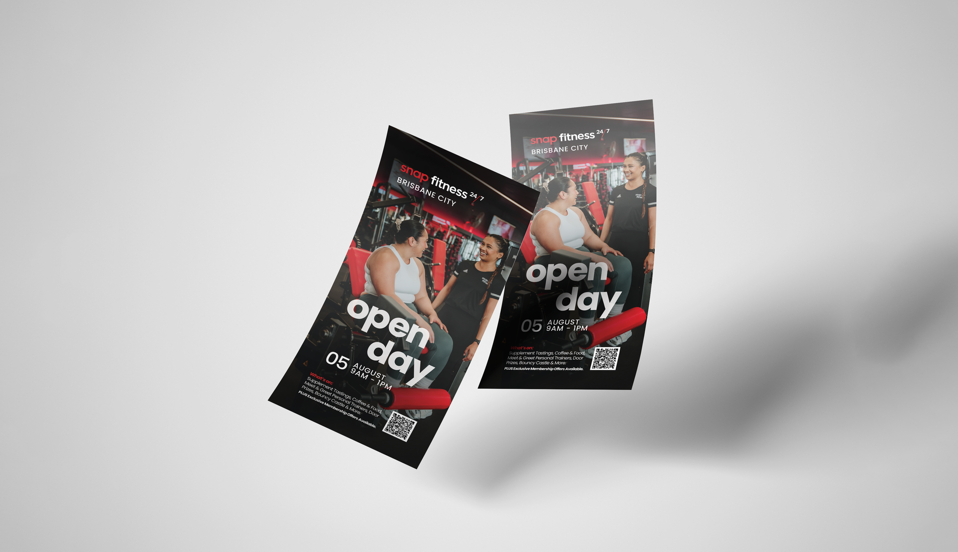 Two flyers for an open day are flying in the air.