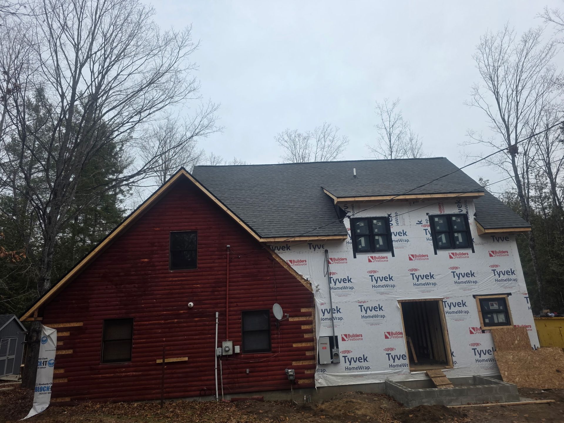 House addition project in Gaylord, MI with a new shingle roof and siding and window installation in progress.