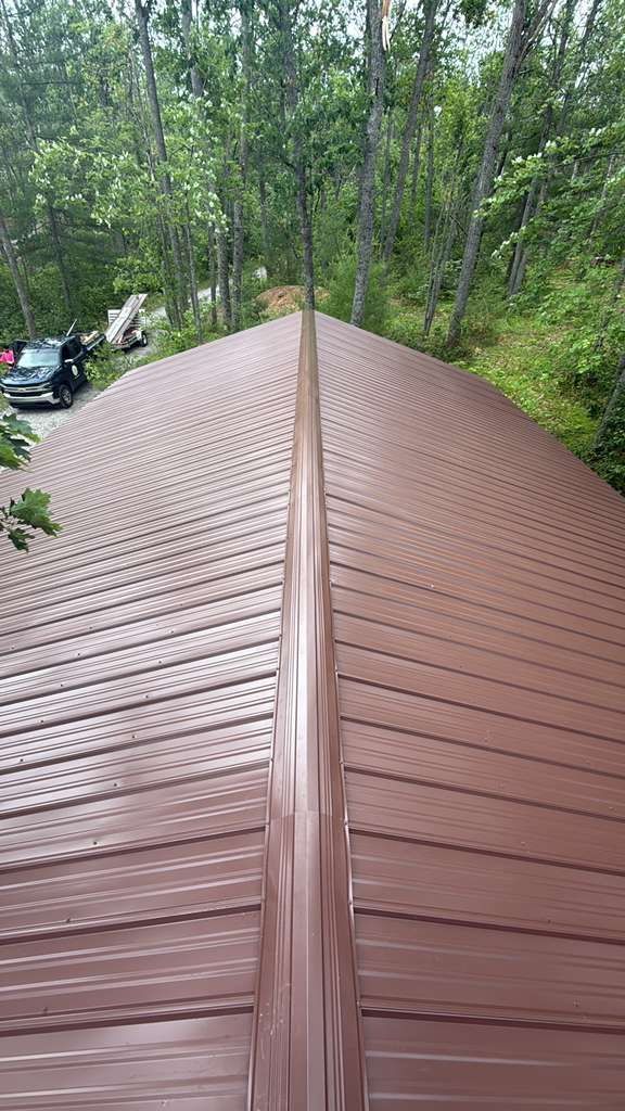 Aerial view of a new brown metal roof installation