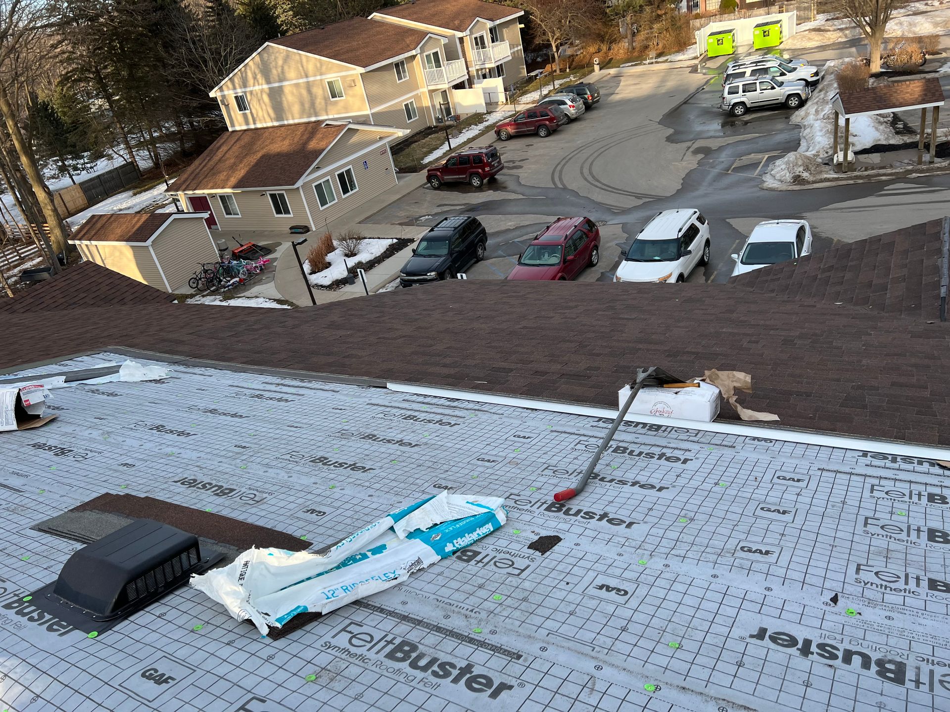 Commercial asphalt single roof installation on an apartment building in Gaylord, MI.